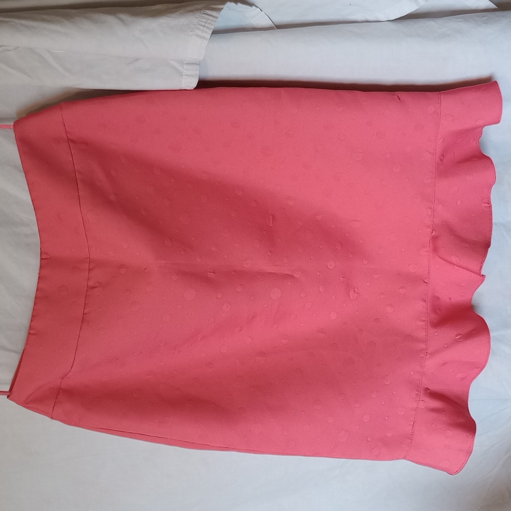 Fun peach ruffle skirt dots in pattern!